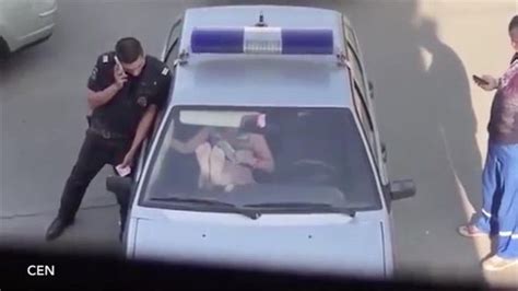 Shocking Moment Girl Tries To Escape Police Car Through