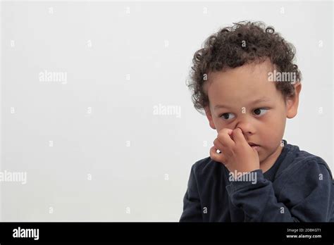 boy picking  nose  white background stock photo stock photo alamy
