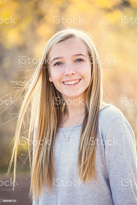 beautiful portrait of smiling teen girl outdoors stock