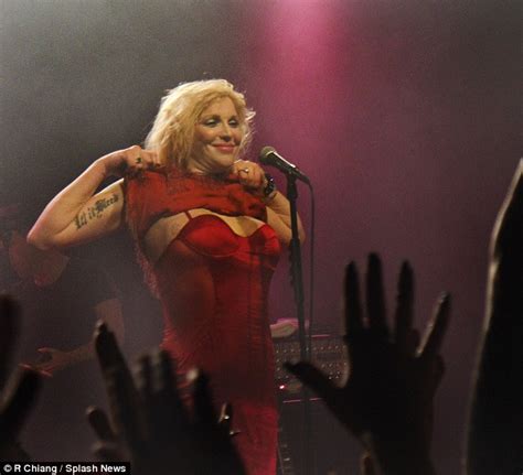 Courtney Love Flashes Her Chest In A Red Corset Dress At The End Of Her
