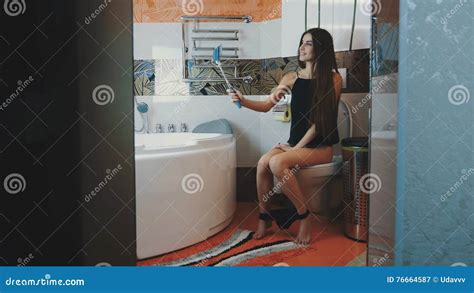 Girl Sitting On Toilet Black Underwear Posing For Selfie On Blue