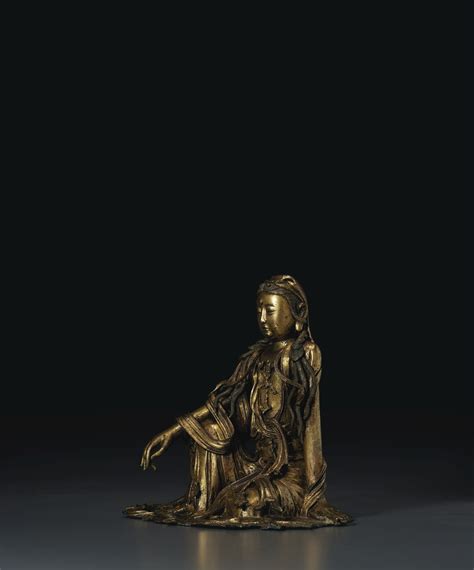 rare gilt bronze figure  white robed guanyin