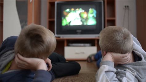 boys watching tv lying  floor stock footage sbv  storyblocks