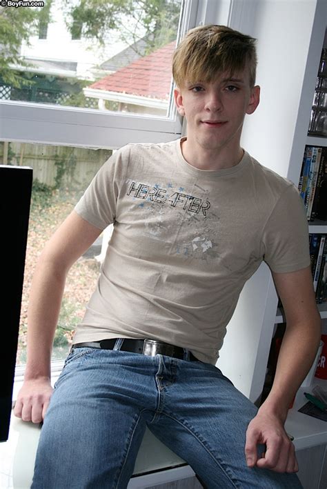 tight twink derek james pulls down his jeans and briefs to