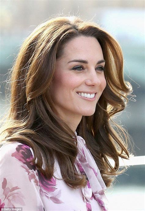 kate flashes her pearly whites as she greets the crowd with a warm