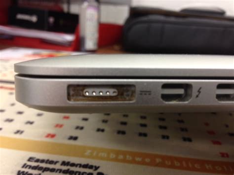 battery    brown sticky residue   macbook pro charge port