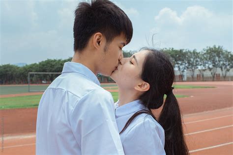 Young Asian College Couple Kissing By Pansfun Images Kissing Couple