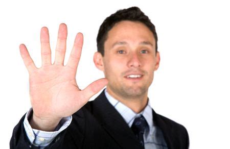 business man showing  hand   white background shallow dof freestock