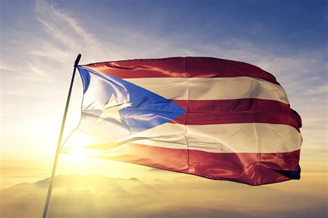 puerto rico rican flag textile cloth fabric waving on the top sunrise