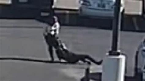 purse snatcher drags woman across parking lot parking lot purses