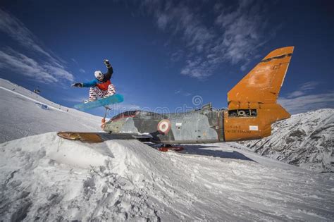 man snowboarding trick jump  mountain snow jump stock photo image