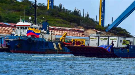 venezuela aid boat docks  curacao   caribbean  navy blocks cargo  reaching