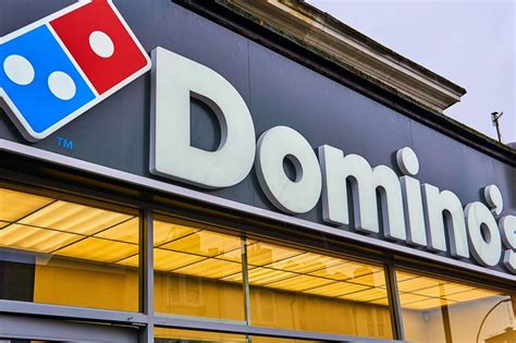 dominos pizza  year profits slip  sales rise news retail week
