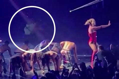 britney spears boobs burst out of her sports bra as she performs seductive workout in her back