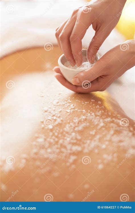 Spa Woman Brunette Getting A Salt Scrub Beauty Treatment In The Stock