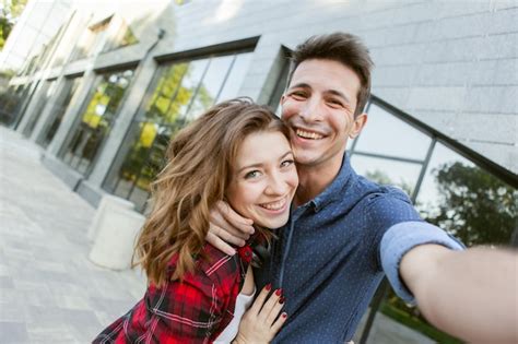 Premium Photo Selfie Portrait Of A Cheerful Funny Couple In Love A
