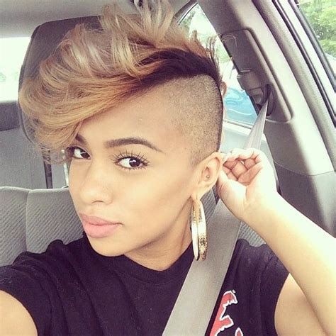 shaved sides hair cut blonde color on top mohawk hairstyles for women