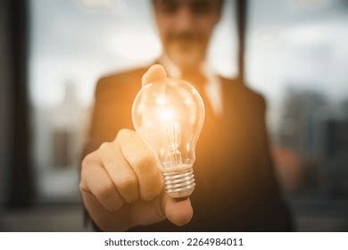 businessman standing workstation lightbulb  hand stock photo