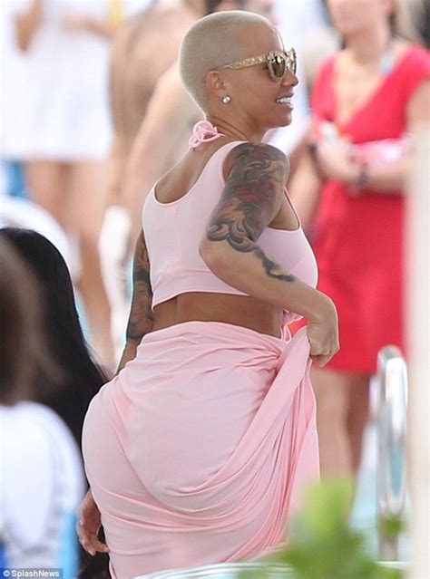 amber rose flashes cleavage during miami beach getaway daily mail online