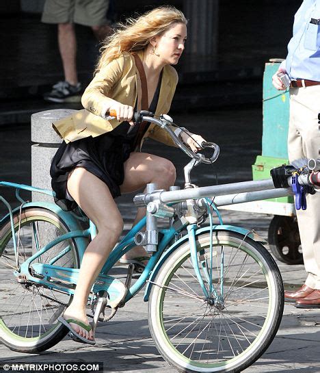 Kate Hudson Struggles With Her Billowing Skirt As She Cycles For New