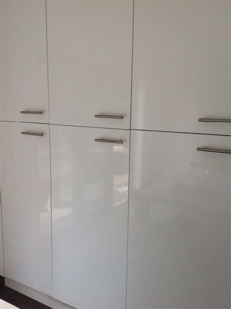 white high gloss kitchen cabinet doors  chrome handles  west