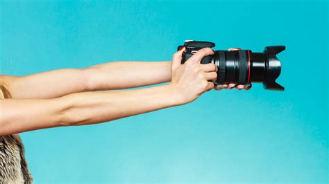 Photographer Hands Holding Camera Shooting Images Androvett