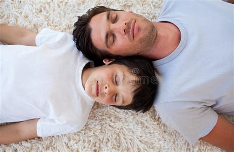 father and his son sleeping on the floor stock image image of relaxing people 11997375