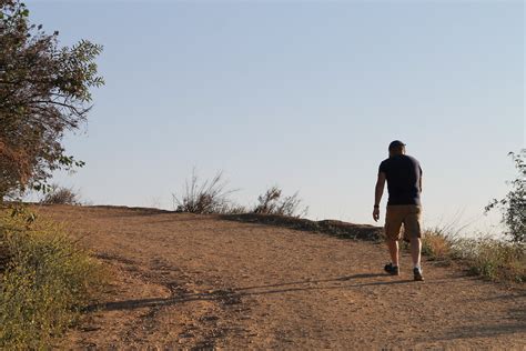 stock photo  man walking   dirt trail