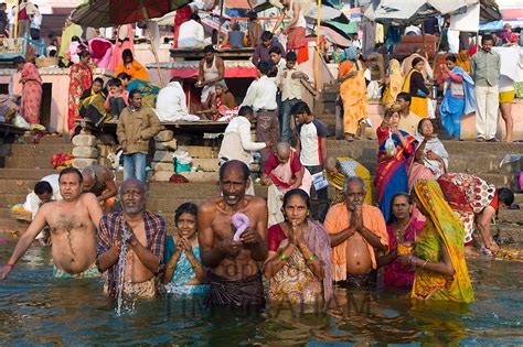 Hindu Pilgrims Bathing In River Ganges Varanasi India