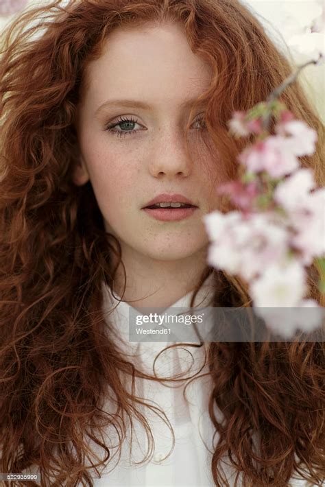 Portrait Of Daydreaming Girl With Curly Red Hair High Res