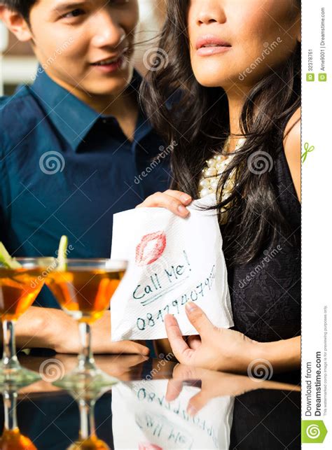 asian woman seduces the man in restaurant stock image