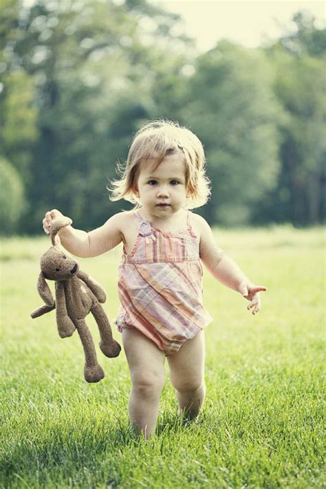 child holding stuffed toy stock photo image  adorable