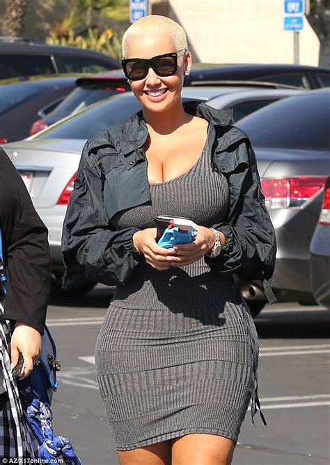 amber rose showcases her curves in skintight mini dress during shopping