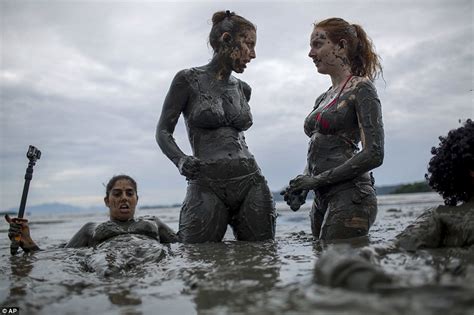 revellers flood seaside for brazilian mud street party daily mail