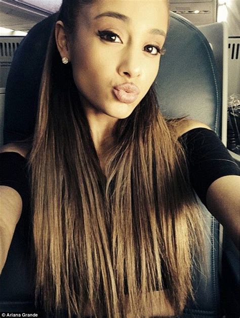 ariana grande says nude photos are fake nominated for six emas her hair cats and ariana grande