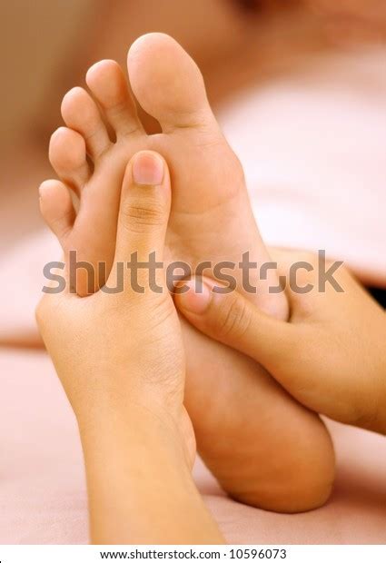 reflexology foot massage spa foot treatment stock photo edit