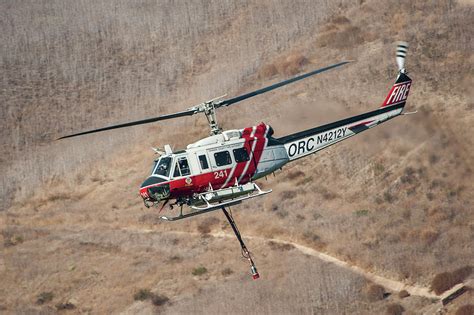 bell uh  iroquois firefighting helicopter photograph  erik simonsen fine art america