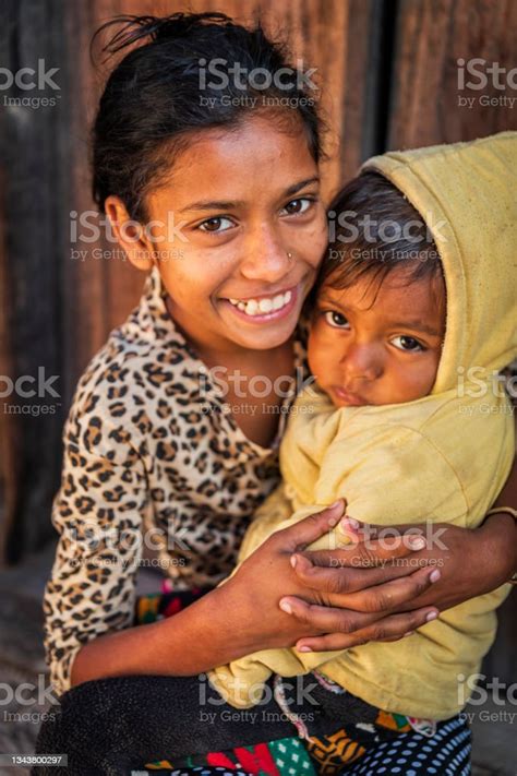 nepali girls holding her little brother durbar square of bhaktapur