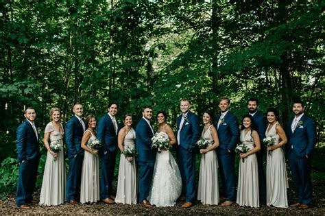 rustic outdoor wedding bridal party groomsmen and bridesmaids navy suits and champagne