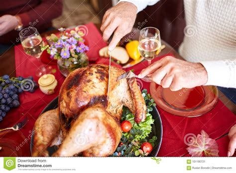 Close Up Old Man Serving Roasted Turkey On A Table