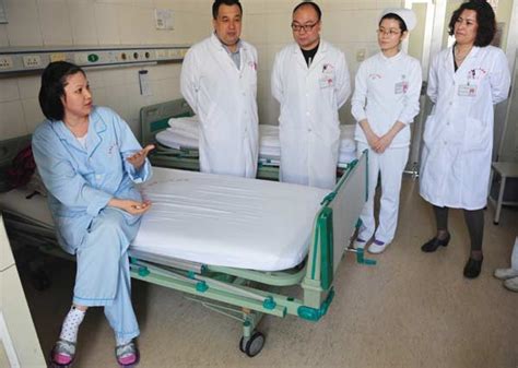 assem a patient from kazakhstan discusses her condition and prognosis with medical staff after