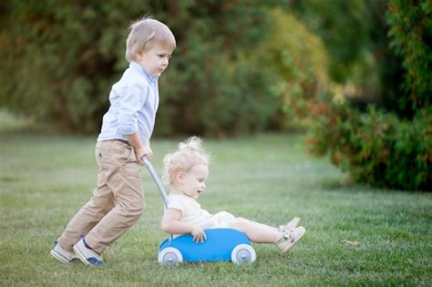 siblings playing together free photo