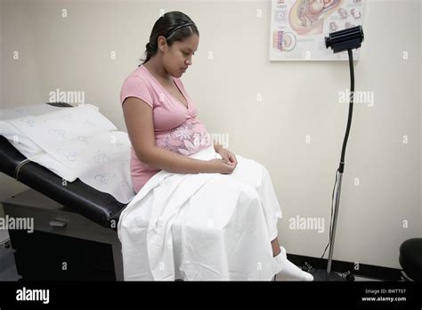 Pregnant Mother Waiting In Doctors Office For A Scheduled Pregnancy