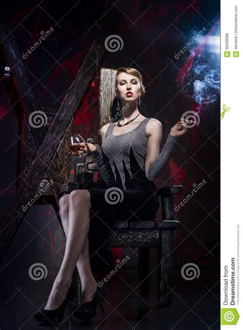 The Smoking Girl With A Wineglass In A Bdsm Interior Stock