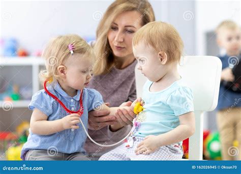 kids learning   teacher   doctor  patient stock image