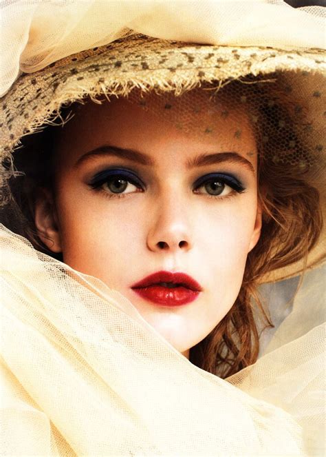 photographer arthur elgort natural auburn redhead with red lipstick and blue eyeshadow looks