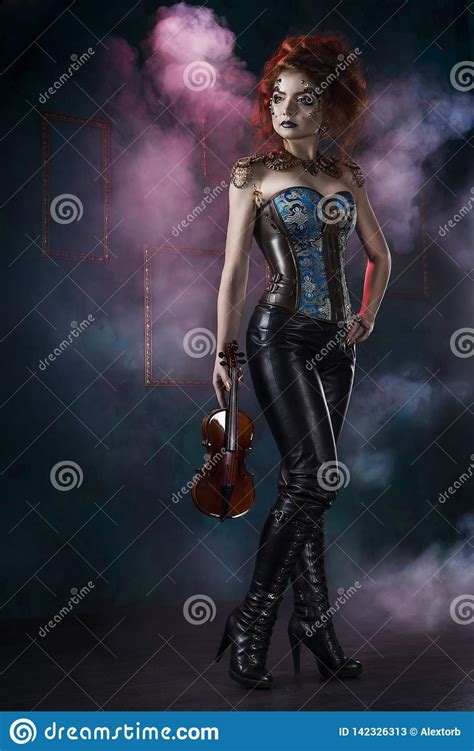 beautiful redhead cosplayer girl wearing a steampunk