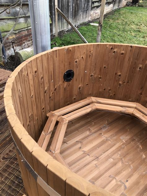 bain nordique en bois thermowood  avec poele immerge par nordikspa