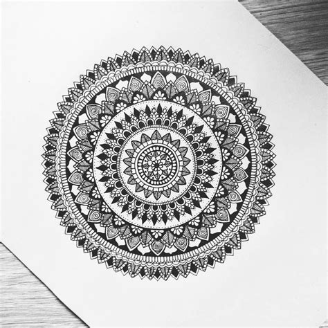 black  white drawing   circular object  top   piece  paper