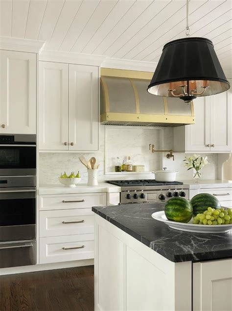 white  gold kitchen  honed black marble countertops transitional